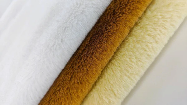 Rabbit faux fur plush fabric close-up